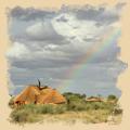 Ein Regenbogen über der Kalahari Red Dunes Lodge